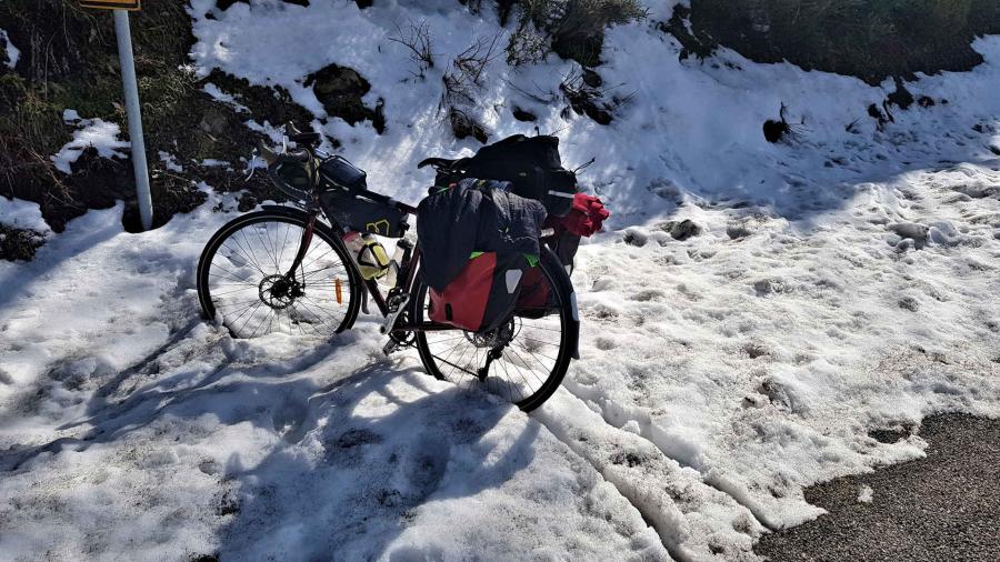 Touring bike standing in snow