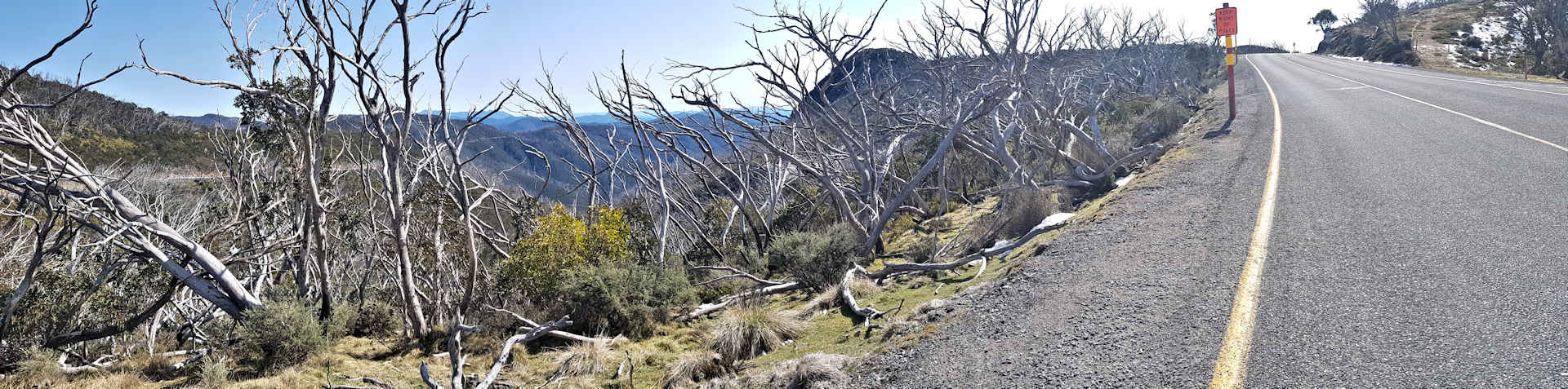 Mt Hotham Road with hi-viz snow poles; Keep Right!